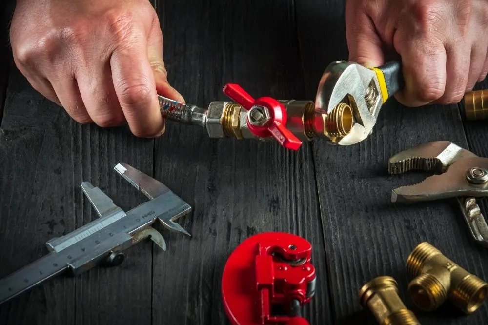 An HVAC expert assembles a valve.