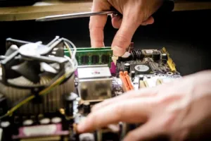 An HVAC expert assembles the electronics components of a new furnace installation.