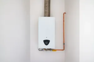 An HVAC company showing off their work with a new heater on the wall.